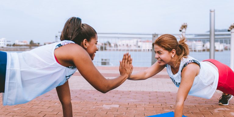 two woman doing exercise 1671217