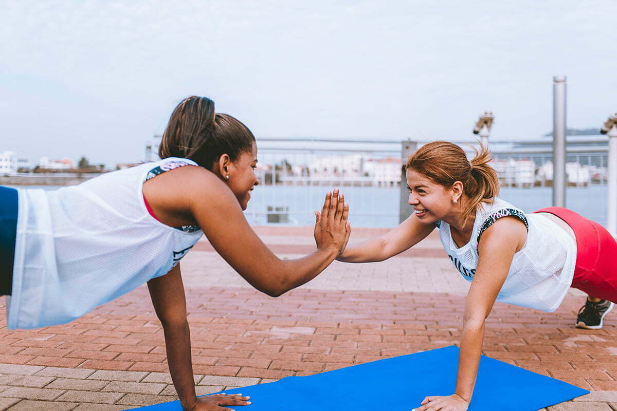 two woman doing exercise 1671217